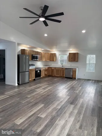 a view of workspace with wooden floor and windows