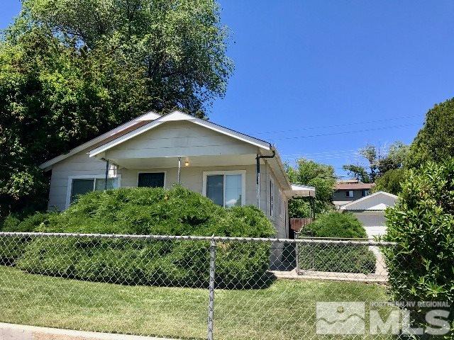 1981 Wilder Street Reno, NV 89512 - Photo 1 of 25 a front view of a house with a yard
