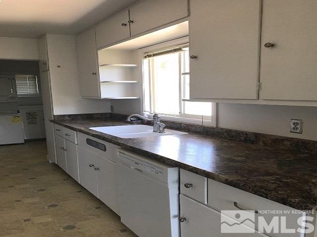 1981 Wilder Street Reno, NV 89512 - Photo 11 of 25 a kitchen with granite countertop a sink a stove and cabinets