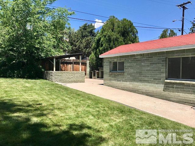 1981 Wilder Street Reno, NV 89512 - Photo 16 of 25 a view of a house with pool and yard