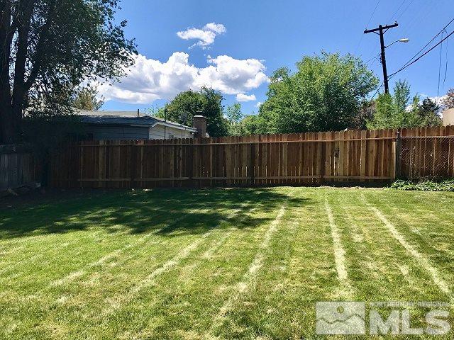 1981 Wilder Street Reno, NV 89512 - Photo 17 of 25 a view of backyard with wooden fence