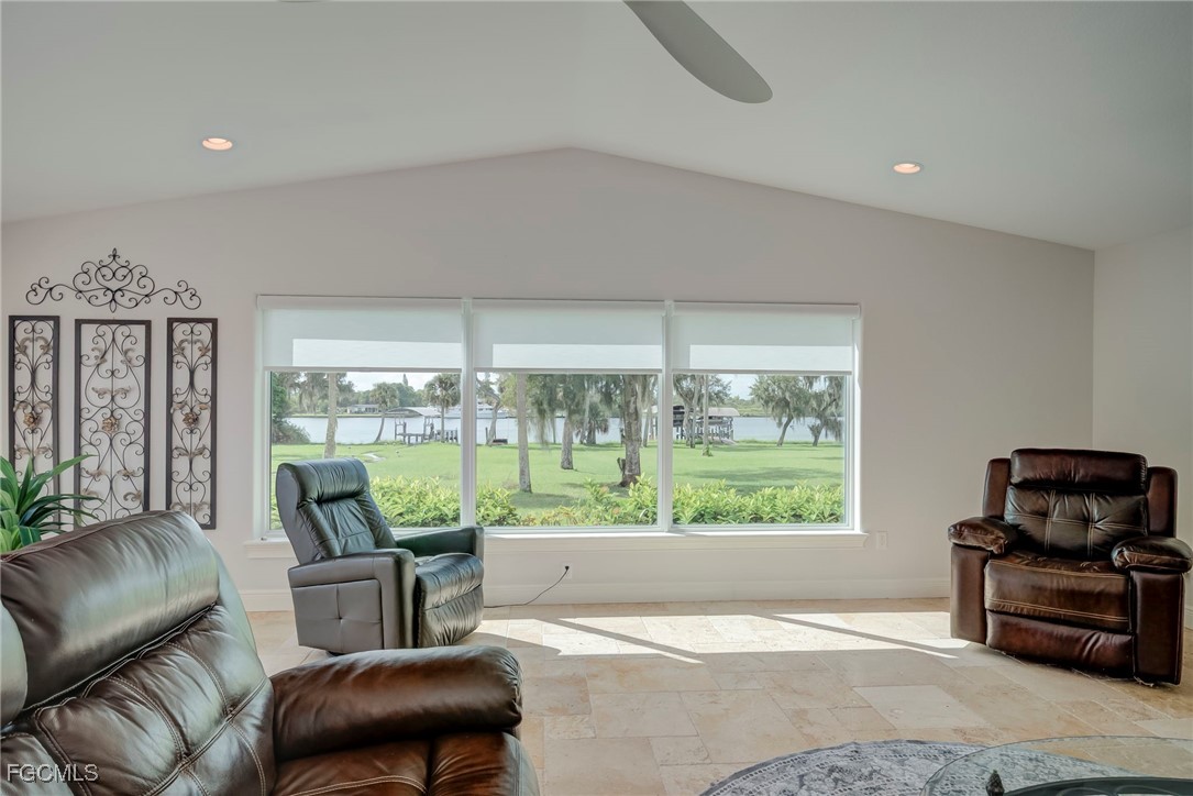 14200 Duke Highway Alva, FL 33920 - Photo 11 of 50 a living room with furniture and a floor to ceiling window