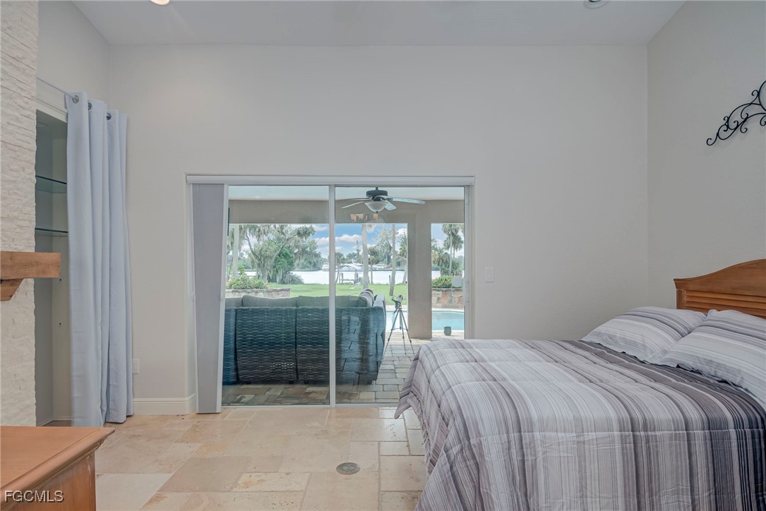 14200 Duke Highway Alva, FL 33920 - Photo 25 of 50 a bedroom with a bed and a large window