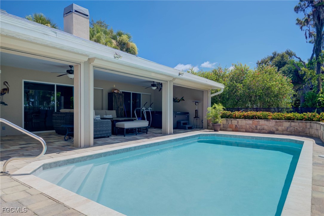 14200 Duke Highway Alva, FL 33920 - Photo 40 of 50 a view of a house with pool and sitting area