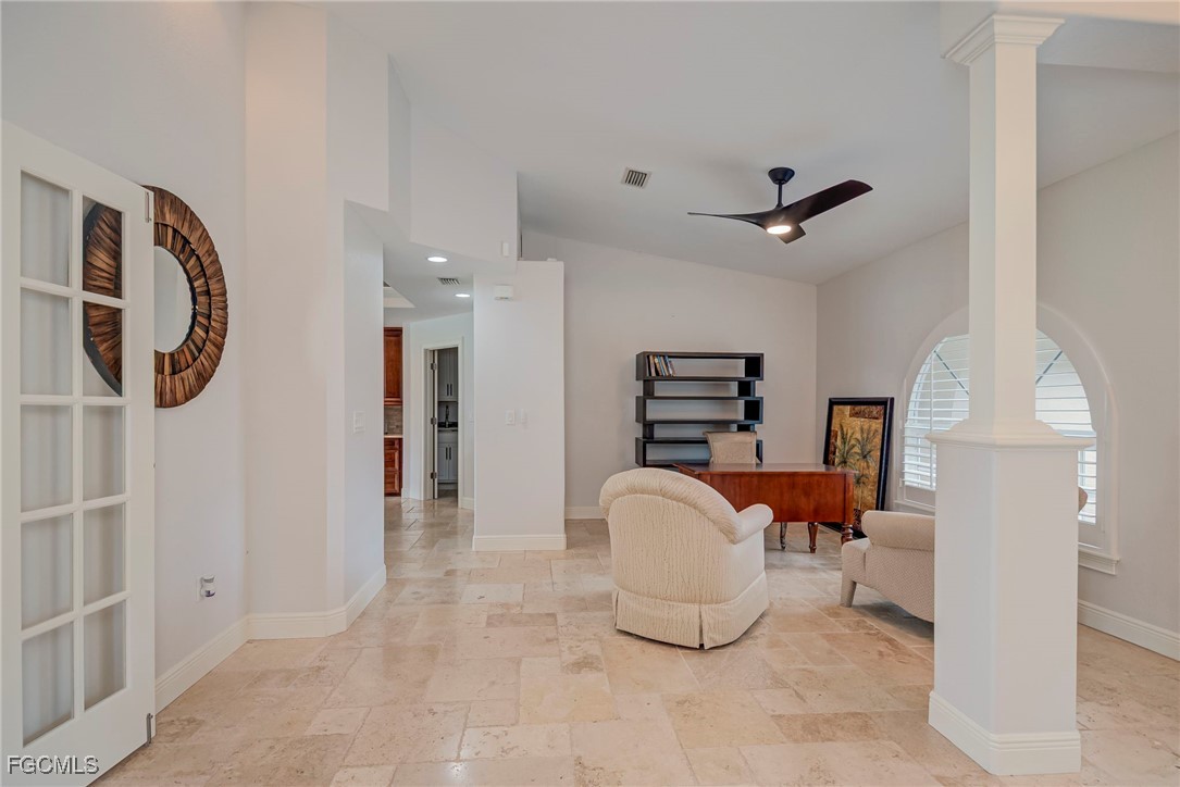 14200 Duke Highway Alva, FL 33920 - Photo 7 of 50 a living room with furniture a clock and a chandelier