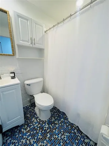 a view of storage and utility room with washer and dryer