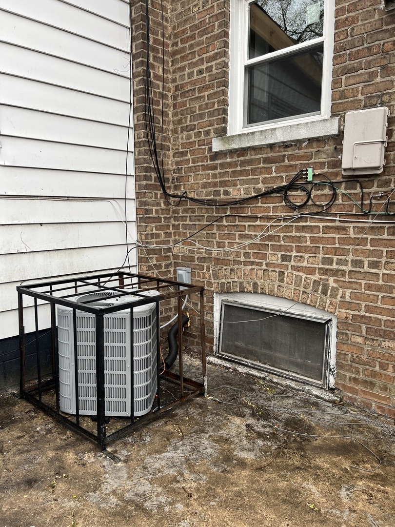 Undisclosed Address Chicago, IL 60620 - Photo 16 of 18 a front view of a house with a grill