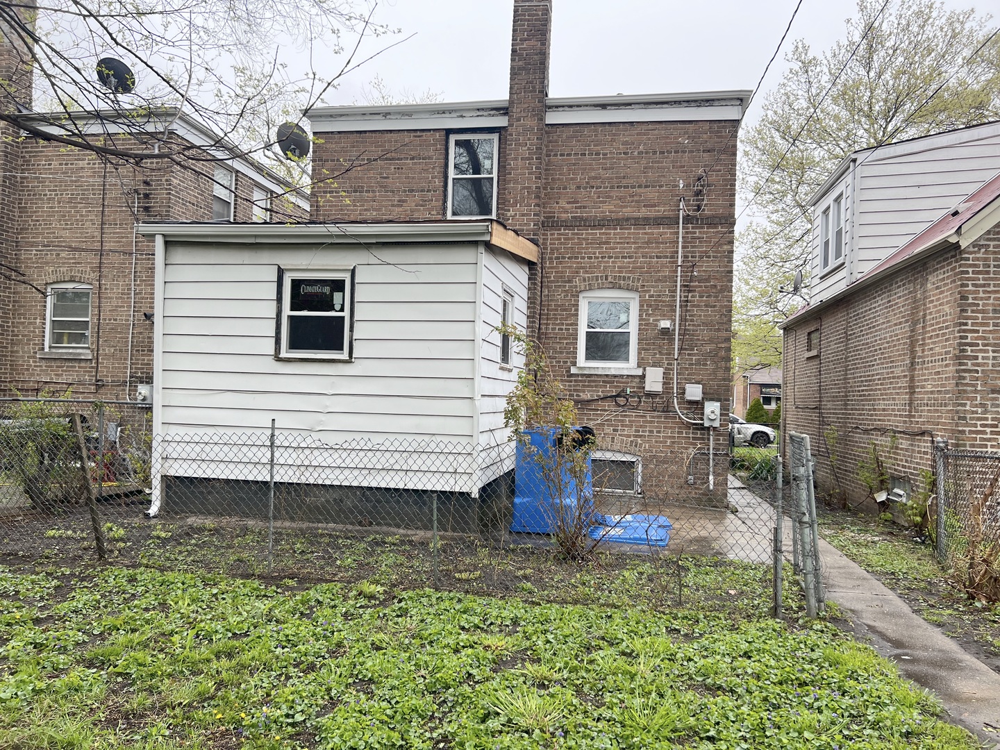 Undisclosed Address Chicago, IL 60620 - Photo 17 of 18 a view of a house with a yard and furniture