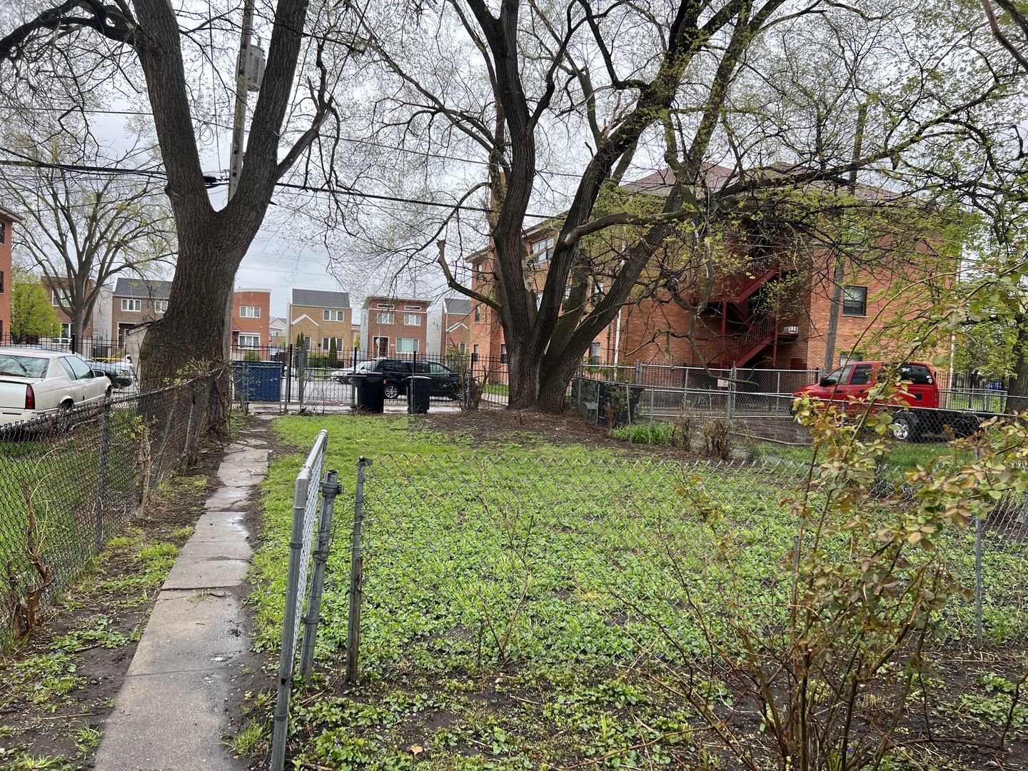 Undisclosed Address Chicago, IL 60620 - Photo 18 of 18 a front view of a house with a yard and fountain