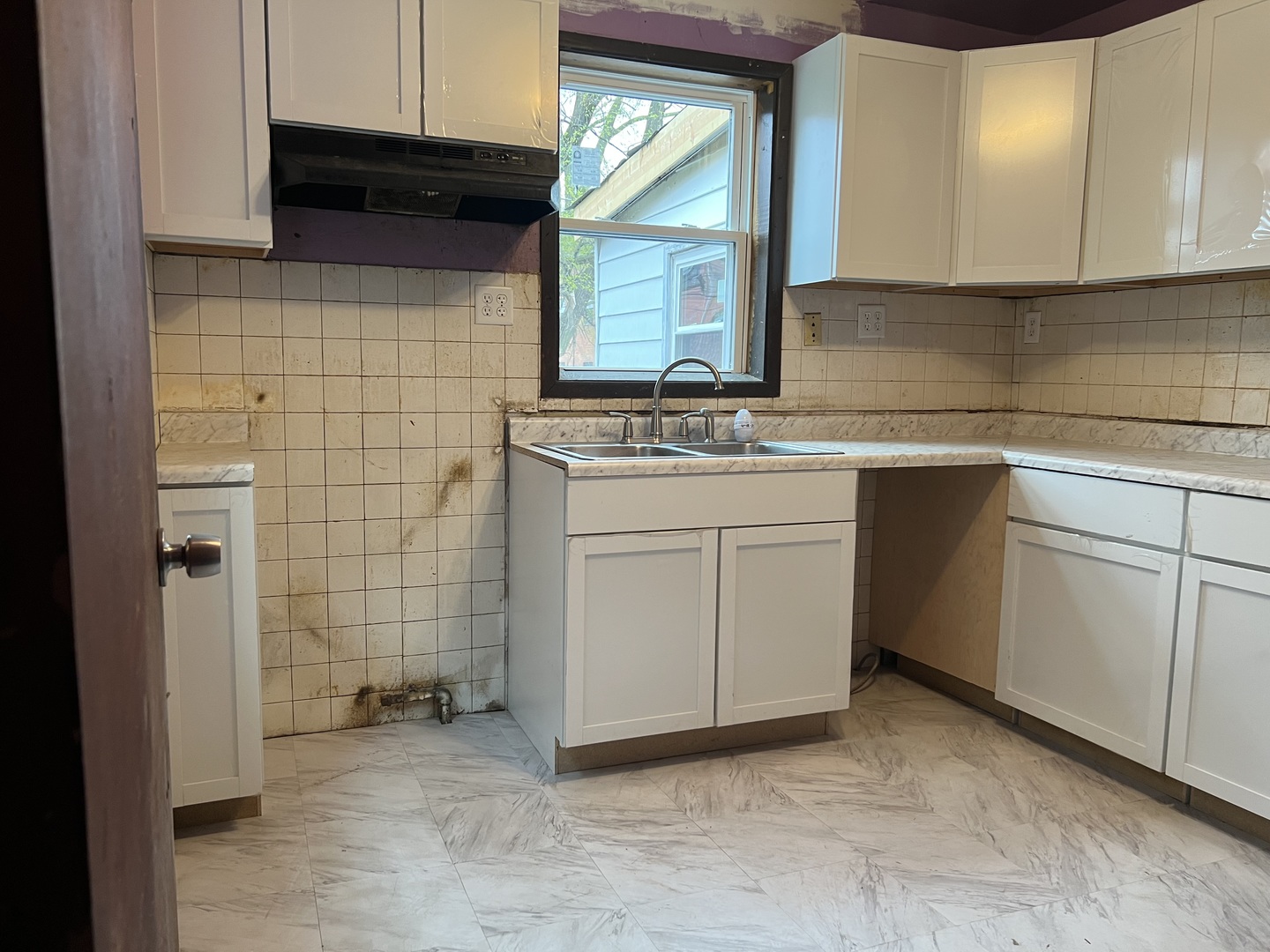 Undisclosed Address Chicago, IL 60620 - Photo 6 of 18 a kitchen with a sink cabinets and appliances
