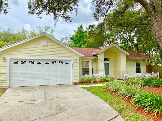 4203 Rocky Ridge Place Sanford, FL 32773 - Photo 1 of 1 a view of a white house with a yard and potted plants