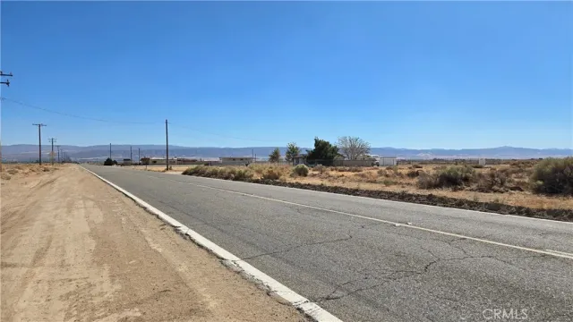 a view of a road with an ocean view