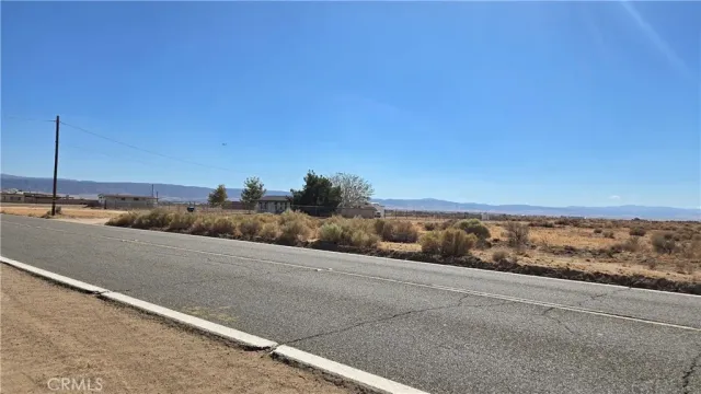 a view of a road with an ocean view