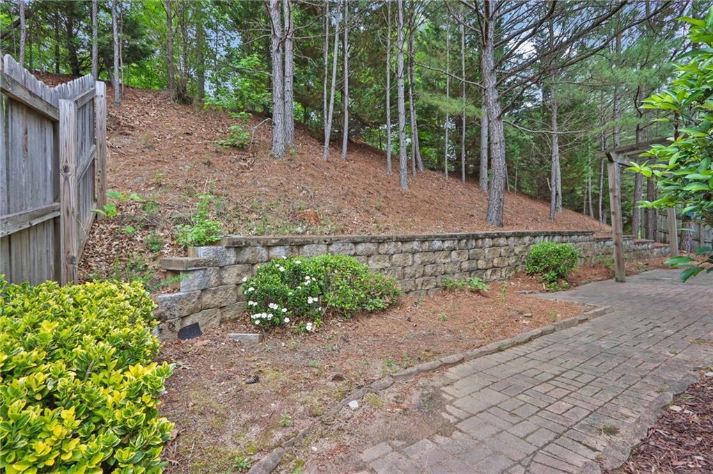 1515 Riva Ridge Suwanee, GA 30024 - Photo 32 of 35 a backyard of a house with lots of green space