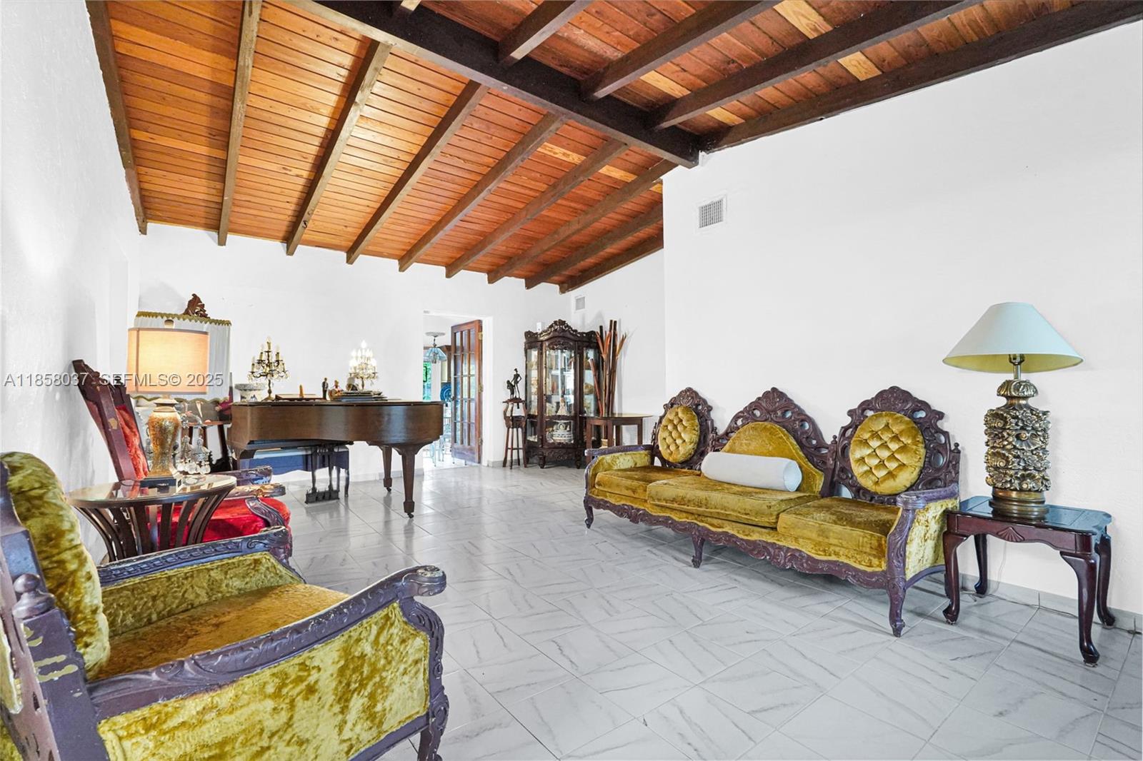 3711 Southwest 87th Avenue Miami, FL 33165 - Photo 14 of 92 a living room with furniture and a chandelier
