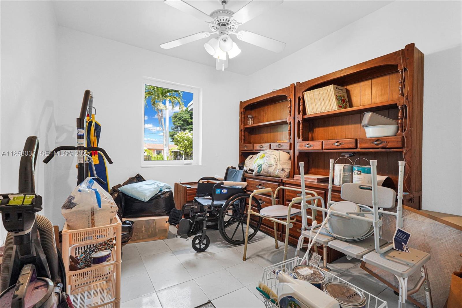 3711 Southwest 87th Avenue Miami, FL 33165 - Photo 20 of 92 a room with gym equipment and a large window