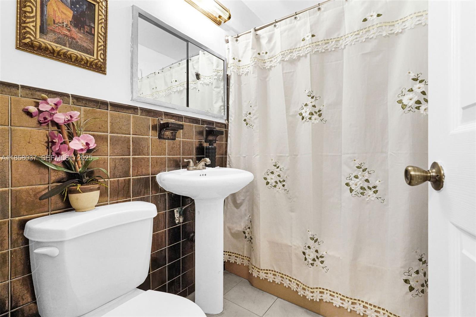 3711 Southwest 87th Avenue Miami, FL 33165 - Photo 21 of 92 a bathroom with a sink toilet and shower