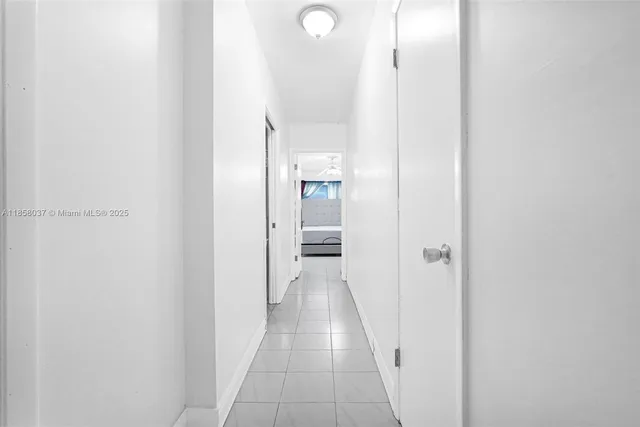 a kitchen with stainless steel appliances granite countertop a stove a refrigerator a sink a dining table and chairs