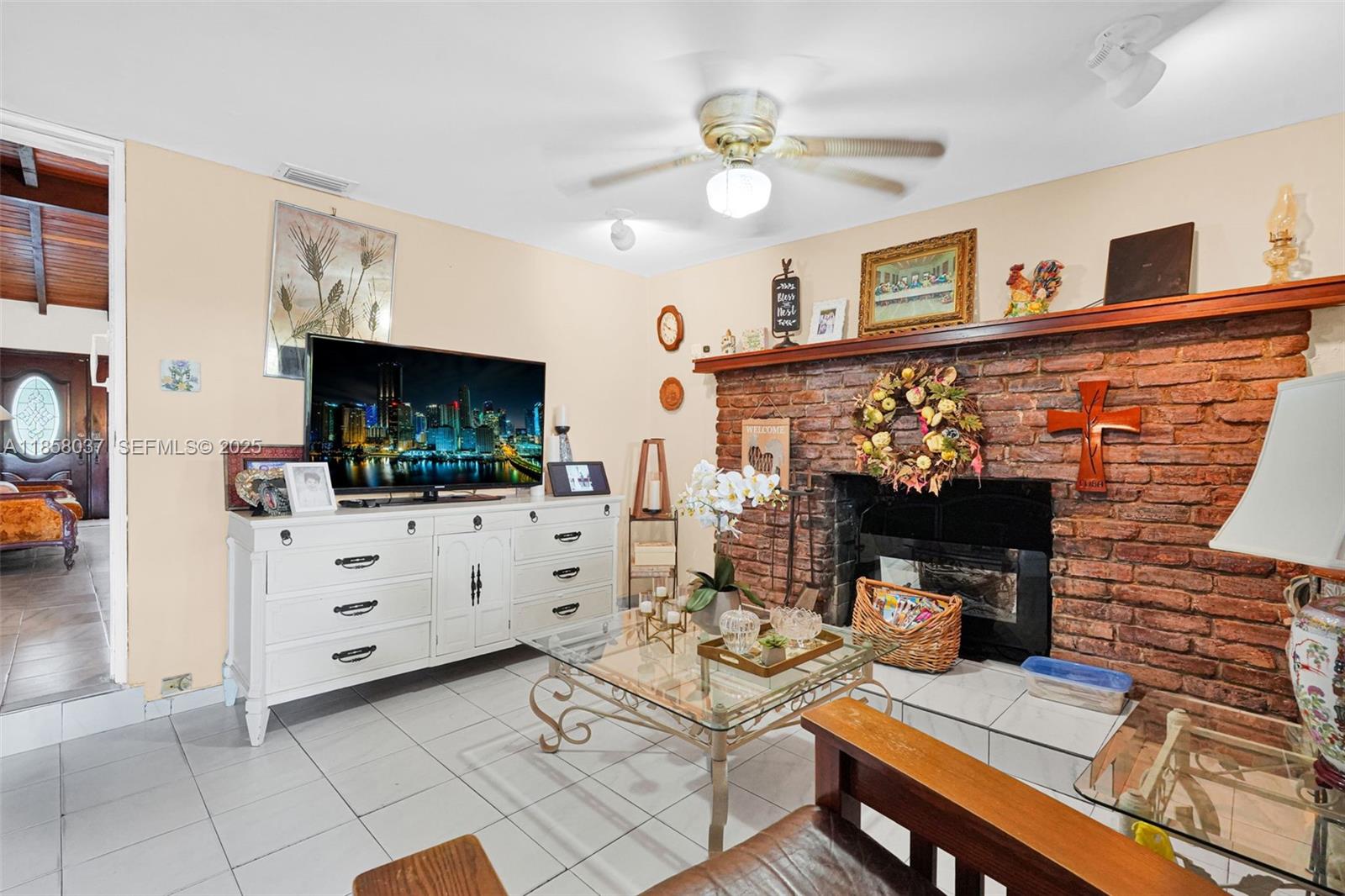 3711 Southwest 87th Avenue Miami, FL 33165 - Photo 35 of 92 a living room with furniture and a fireplace