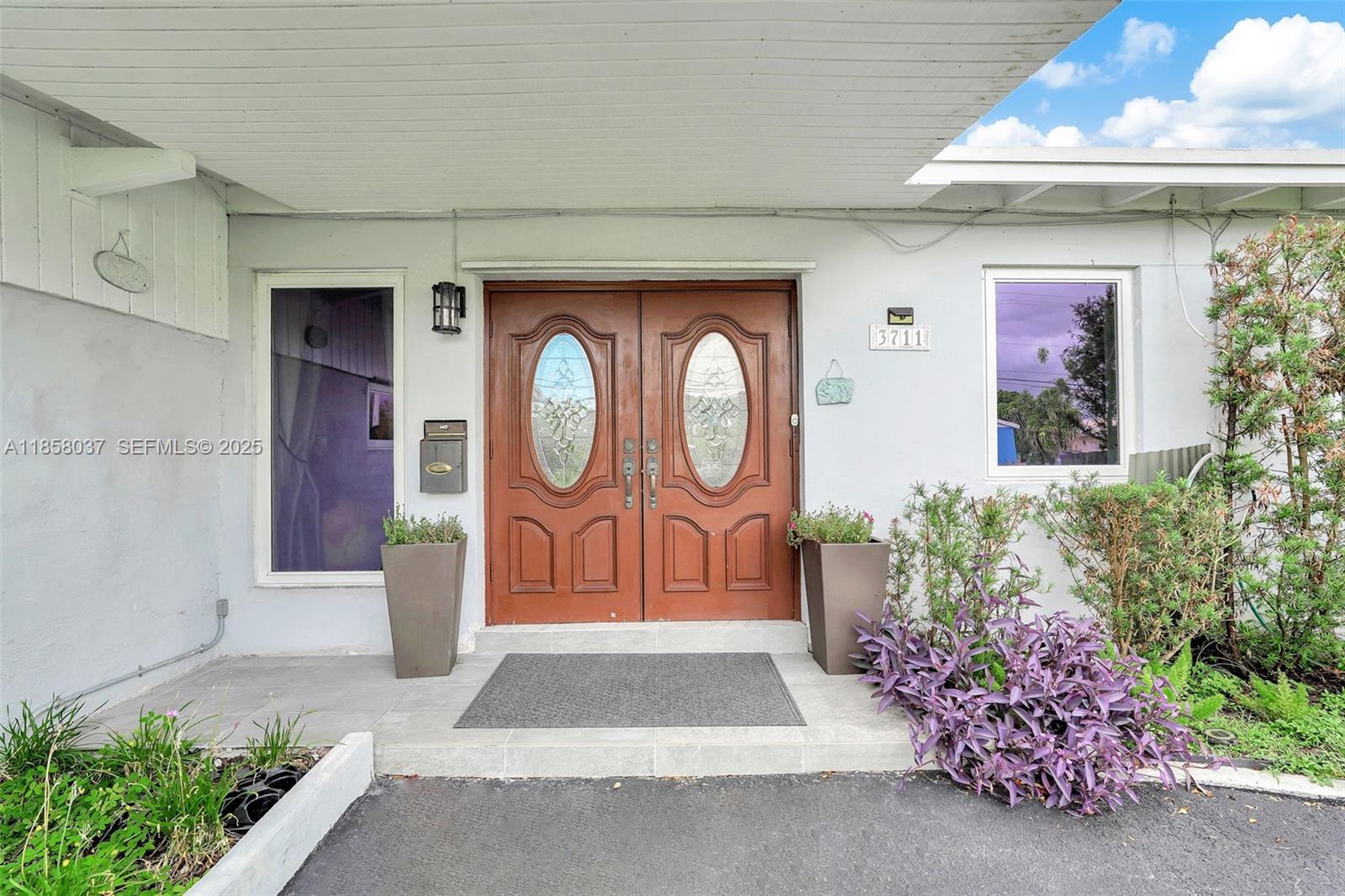 3711 Southwest 87th Avenue Miami, FL 33165 - Photo 67 of 92 a front view of a house