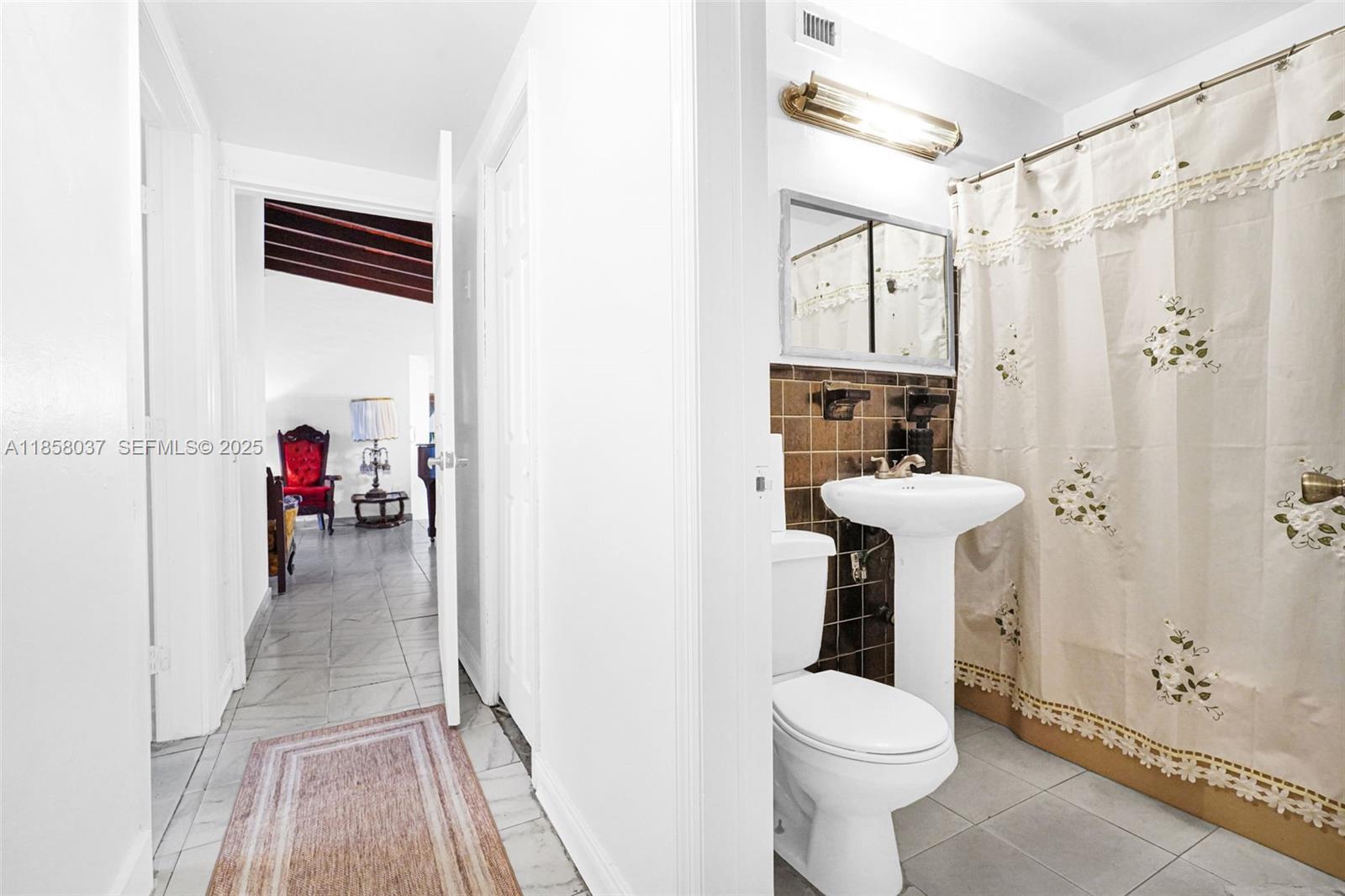 3711 Southwest 87th Avenue Miami, FL 33165 - Photo 88 of 92 a bathroom with a sink toilet and shower