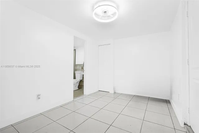 a bathroom with a sink toilet and a mirror