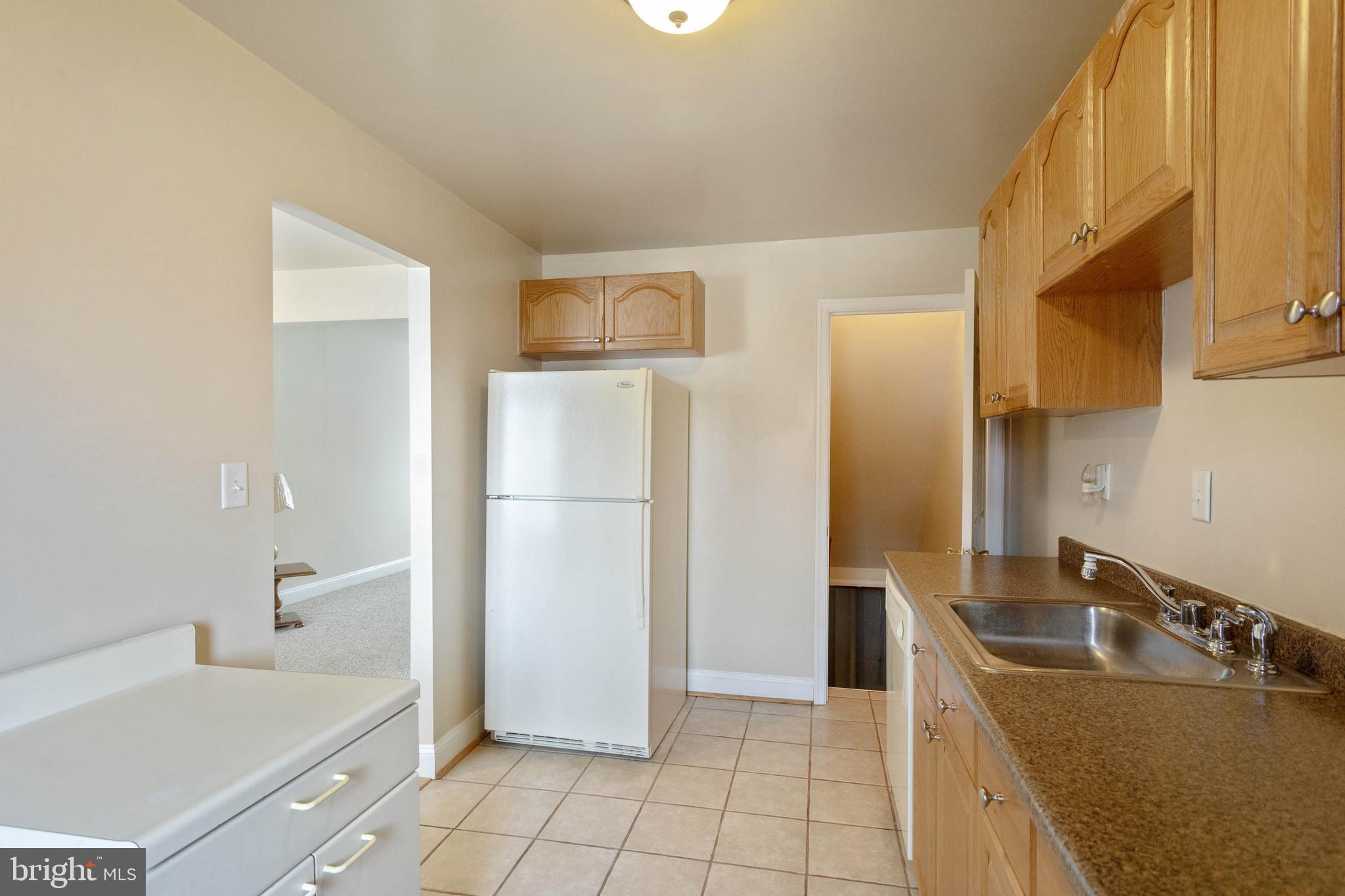 503 Grovethorn Road Baltimore, MD 21220 - Photo 12 of 31 Kitchen with Tile Floor & Basement Access