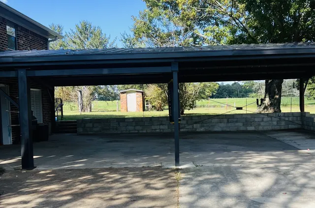 a view of porch with a yard