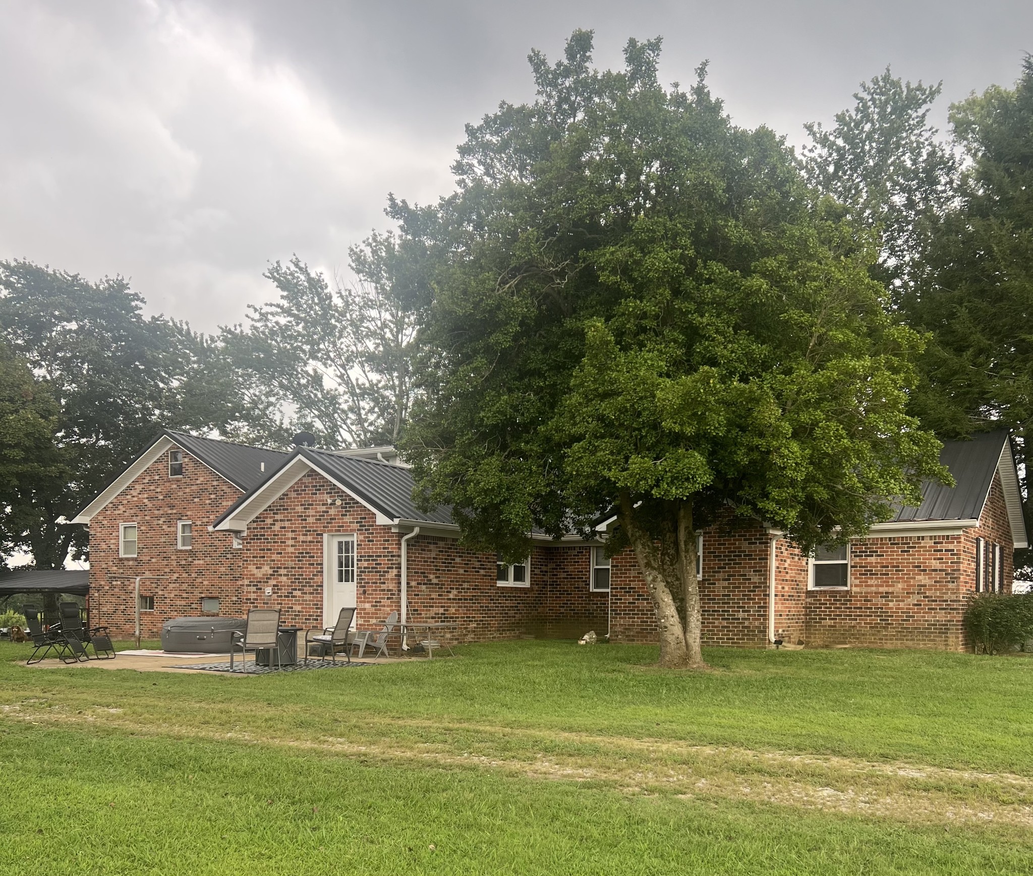 566 Clarence Finney Road Hillsboro, TN 37342 - Photo 32 of 47 a front view of a house with a garden