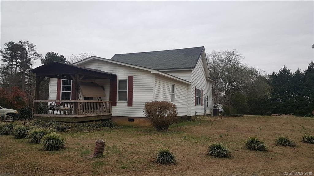 3220 Edwards Road Wingate, NC 28174 - Photo 1 of 21 a view of a house with backyard and trees