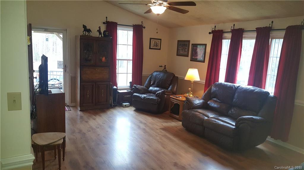 3220 Edwards Road Wingate, NC 28174 - Photo 2 of 21 a living room with furniture and a fireplace