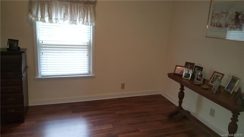 3220 Edwards Road Wingate, NC 28174 - Photo 14 of 21 a room with a window and wooden floor
