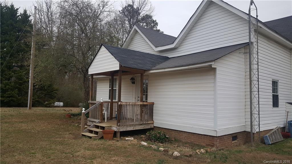 3220 Edwards Road Wingate, NC 28174 - Photo 16 of 21 a white house covered with tall trees