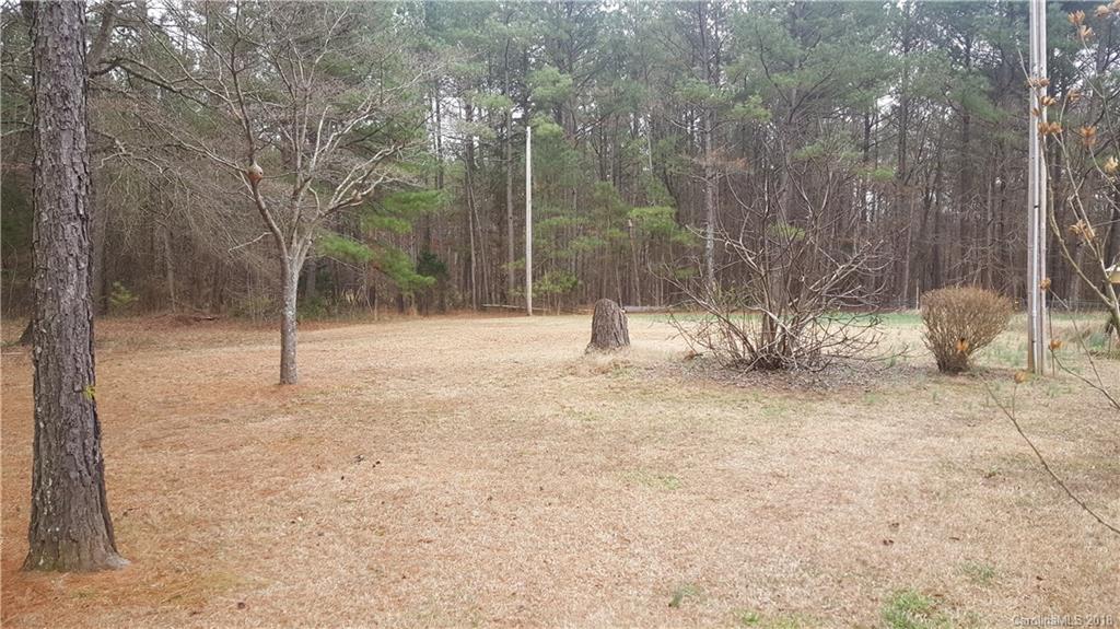 3220 Edwards Road Wingate, NC 28174 - Photo 20 of 21 a view of a tree with a yard