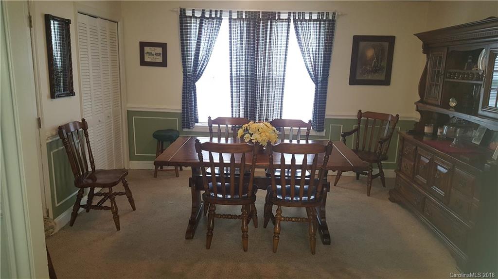3220 Edwards Road Wingate, NC 28174 - Photo 6 of 21 a view of a dining room with furniture and chandelier