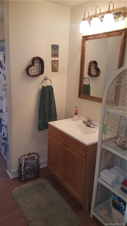 3220 Edwards Road Wingate, NC 28174 - Photo 7 of 21 a bathroom with a sink and a mirror