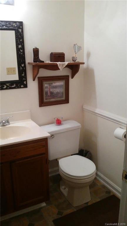 3220 Edwards Road Wingate, NC 28174 - Photo 10 of 21 a bathroom with a toilet a sink and a mirror