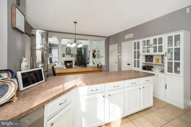 a kitchen with stainless steel appliances granite countertop a sink and cabinets