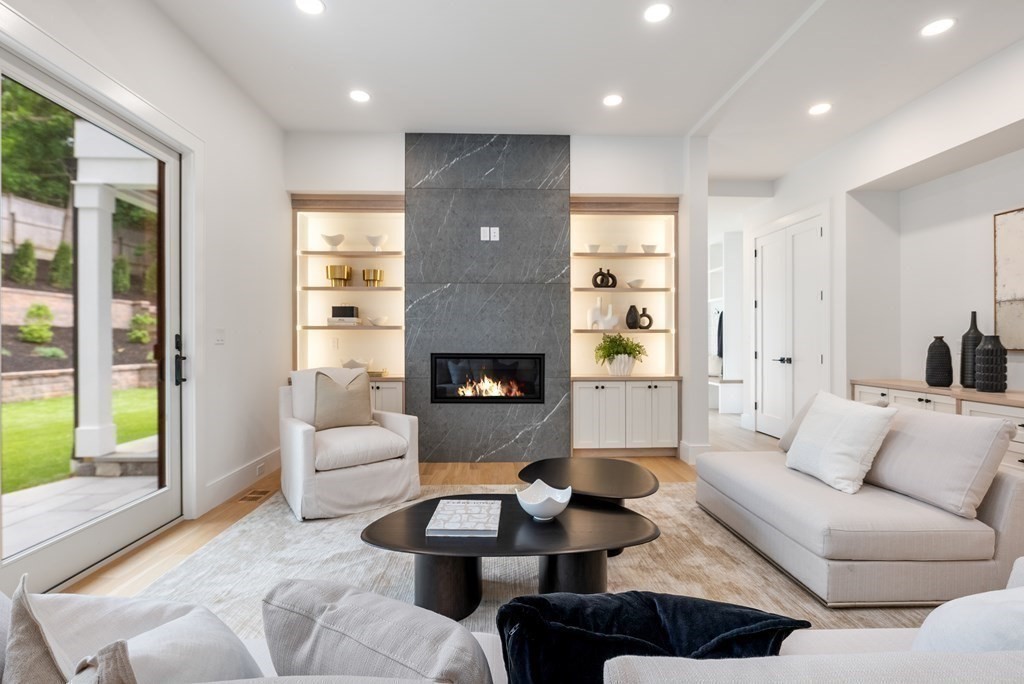 91 Oldham Road Newton, MA 02465 - Photo 13 of 38 a living room with furniture fireplace and a large window