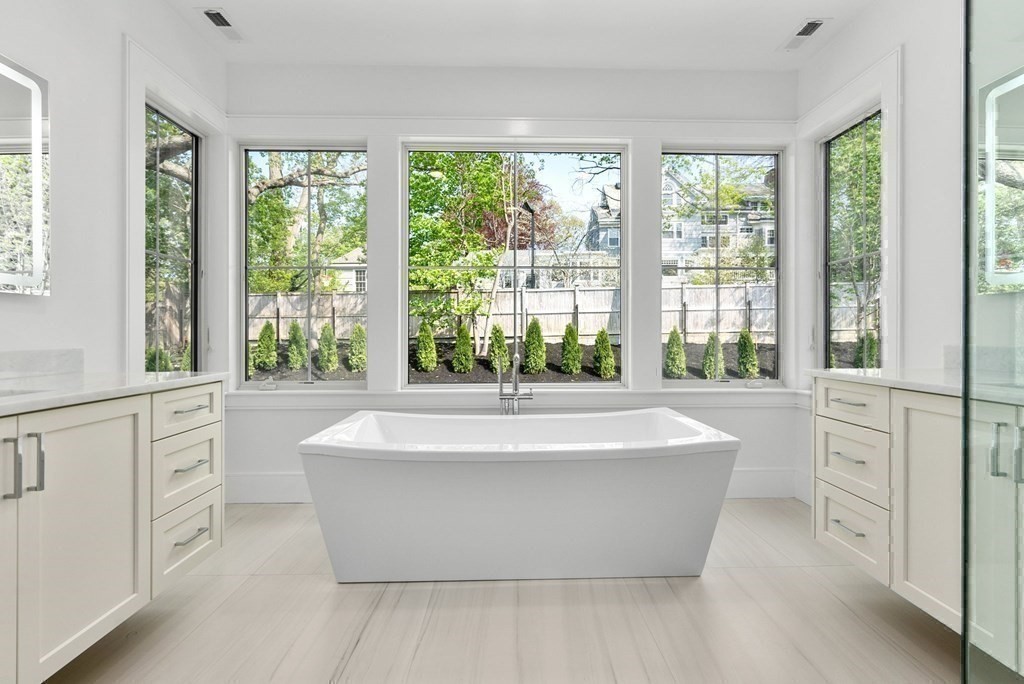 91 Oldham Road Newton, MA 02465 - Photo 19 of 38 a spacious bathroom with bathtub and shower
