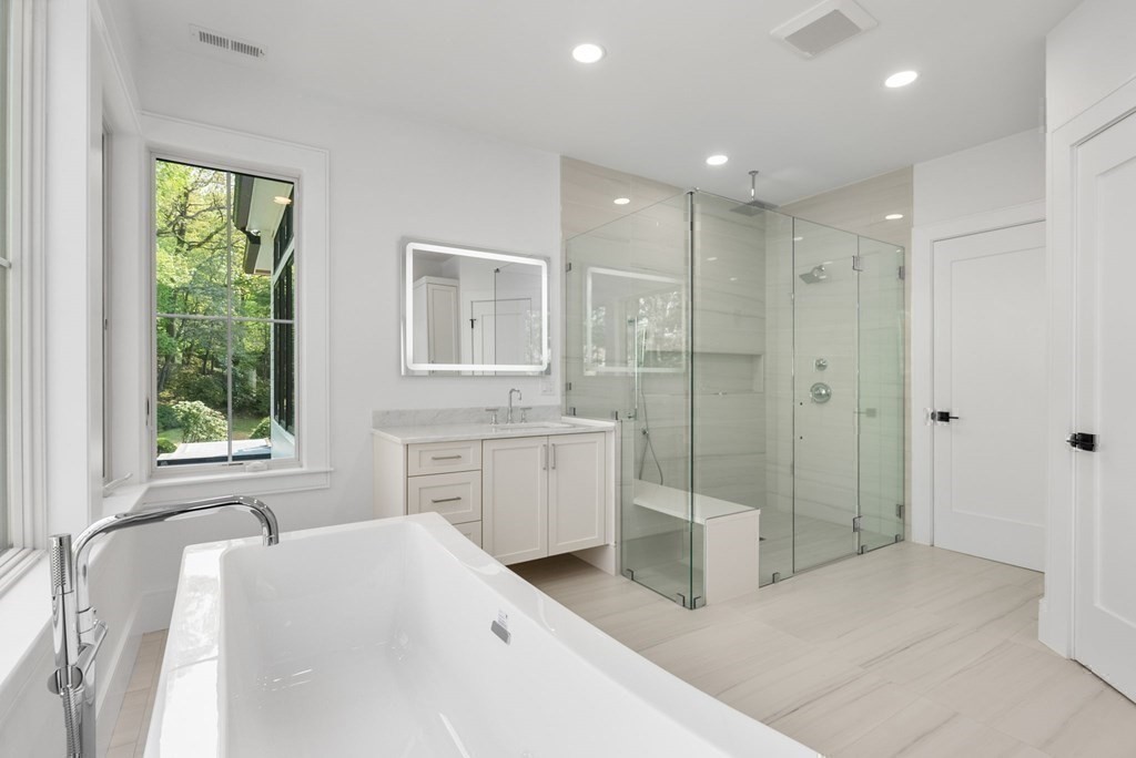 91 Oldham Road Newton, MA 02465 - Photo 20 of 38 a bathroom with a sink a toilet and shower