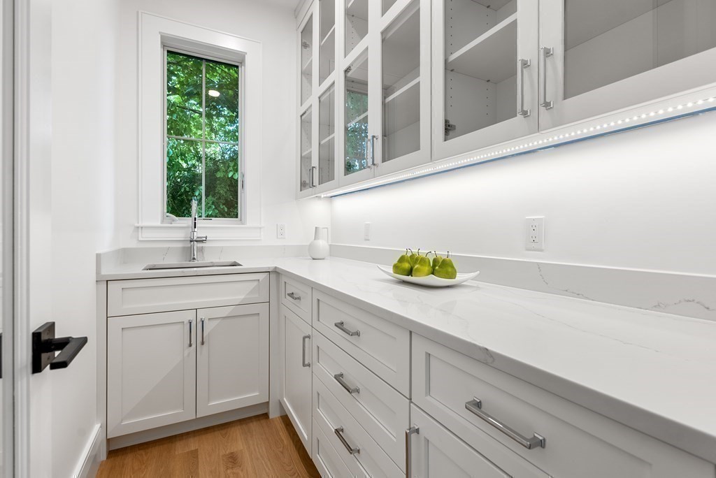 91 Oldham Road Newton, MA 02465 - Photo 6 of 38 a kitchen with a sink and a window