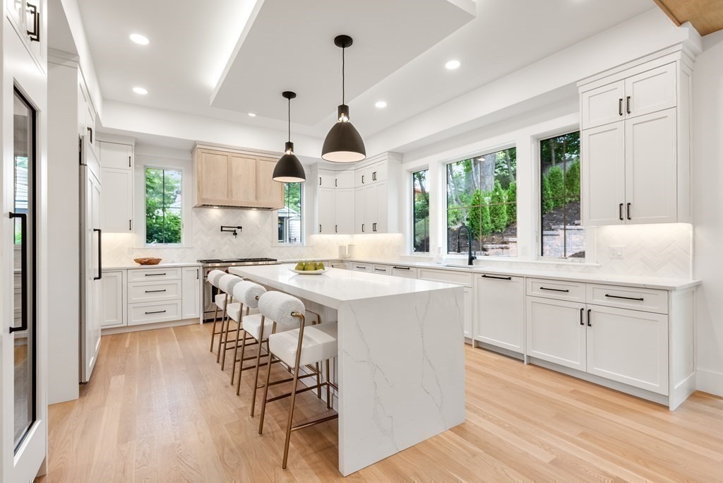 91 Oldham Road Newton, MA 02465 - Photo 8 of 38 a kitchen with counter top space a sink appliances and cabinets