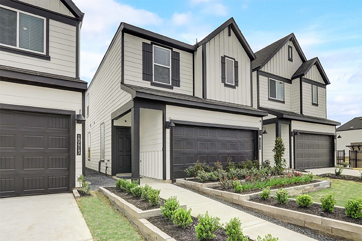 10409 Lancaster Frst Lane Houston, TX 77051 - Photo 1 of 50 a front view of a house with a yard and garage