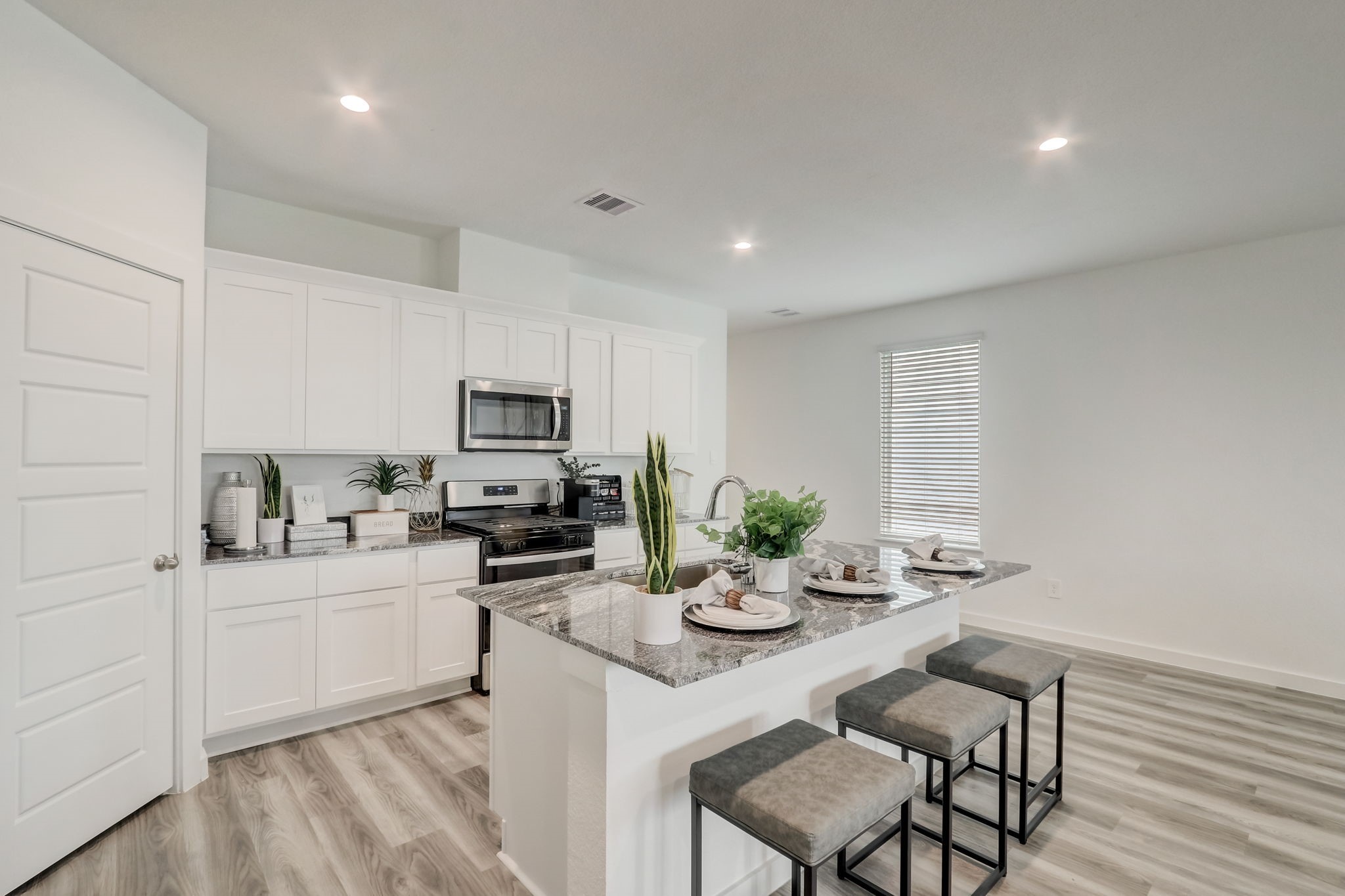 10409 Lancaster Frst Lane Houston, TX 77051 - Photo 16 of 50 a kitchen with sink cabinets and microwave