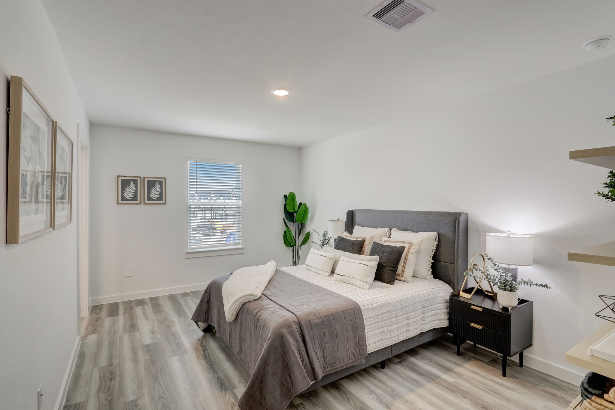 10409 Lancaster Frst Lane Houston, TX 77051 - Photo 22 of 50 a bedroom with a bed and wooden floor