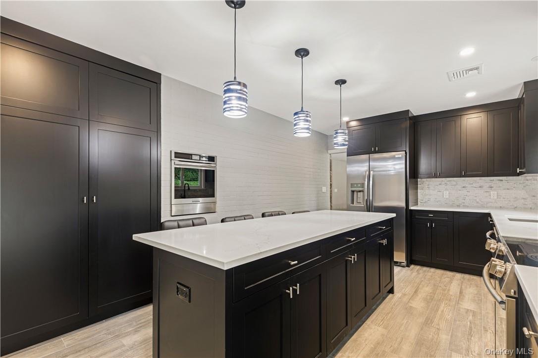 5 Paddock Road Rye Brook, NY 10573 - Photo 7 of 23 Kitchen featuring stainless steel appliances, large pantry and wall oven
