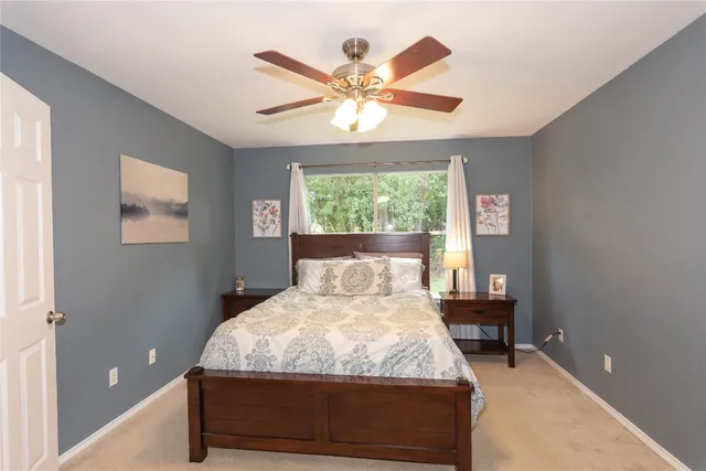 a bedroom with a bed and window