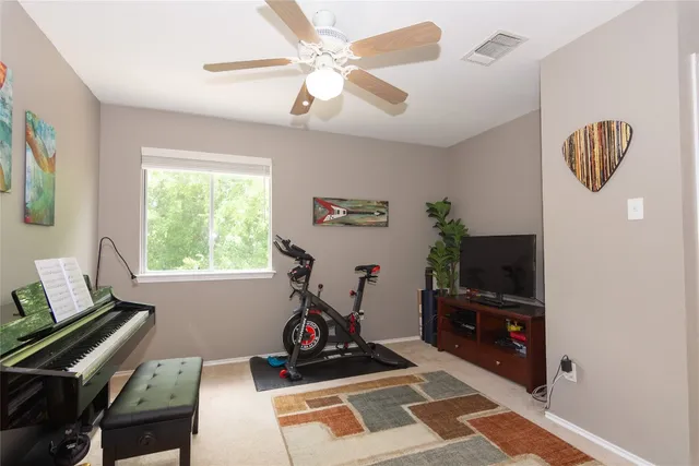 a room with furniture and a flat screen tv