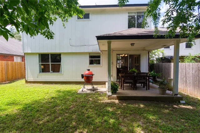 a house view with a sitting space and garden space